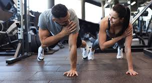Toning Bingo Wings: Your Ultimate Guide to Sculpting Sleek Arms at the Gym 3 Fitness trainer demonstrating arm toning exercises Matlock